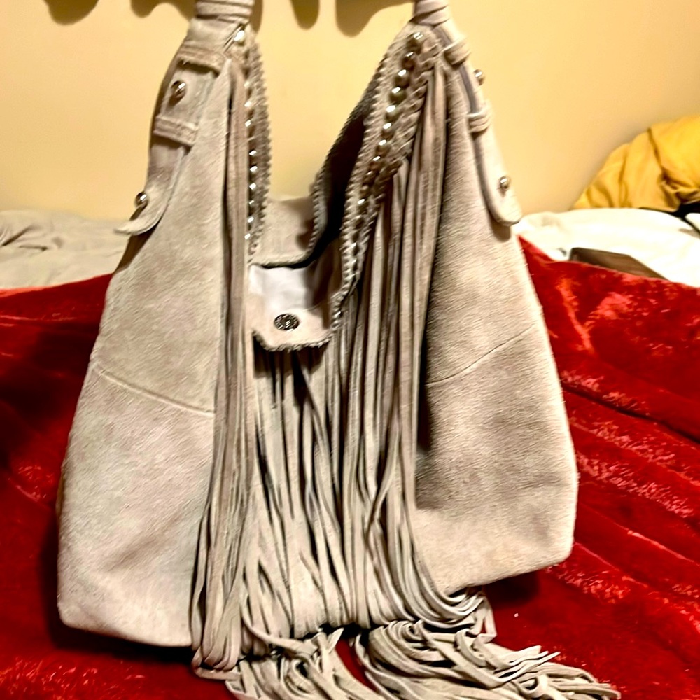 Gorgeous Sandra Robert’s stone colored suede fringe hobo bag.